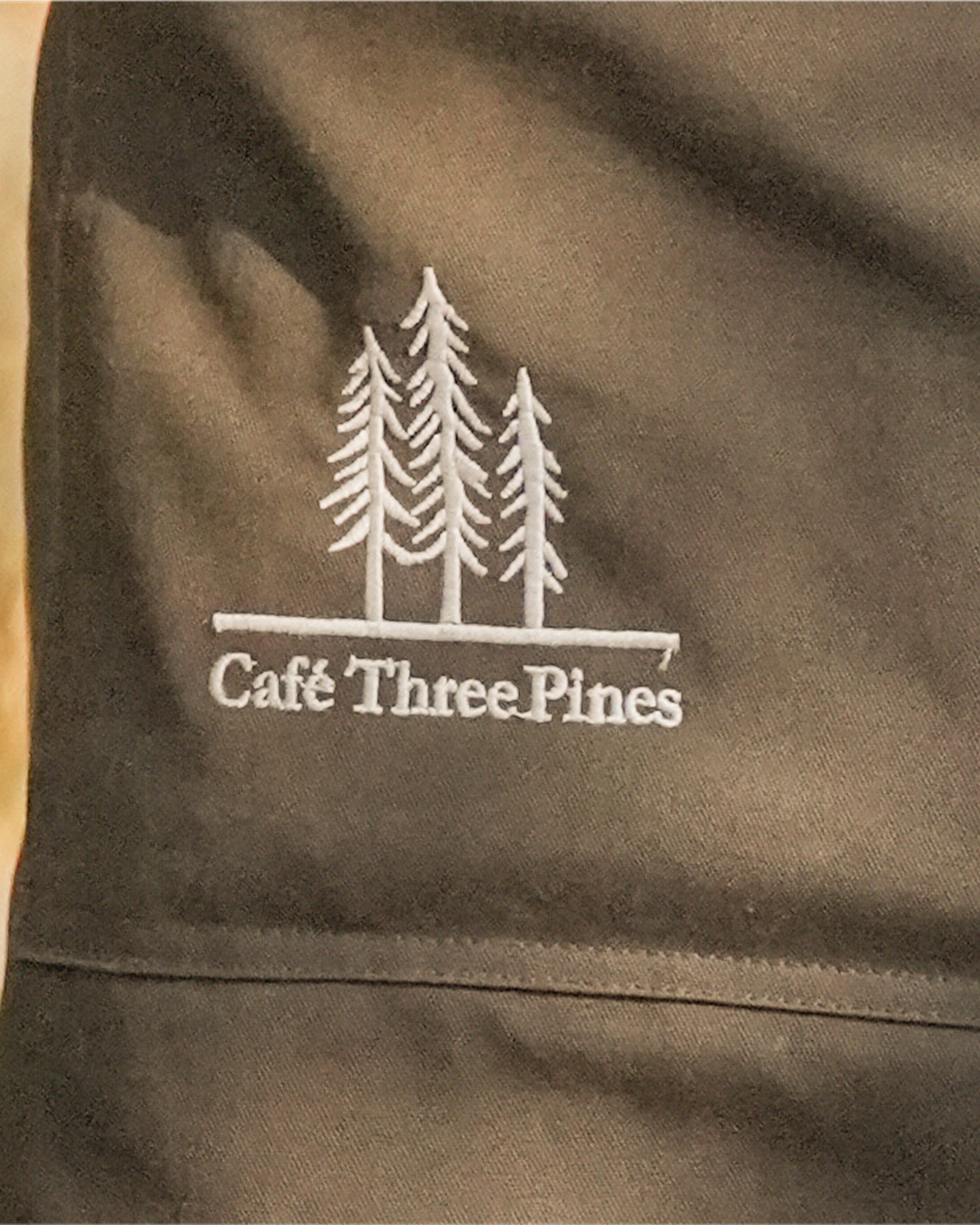 Café Three Pines apron